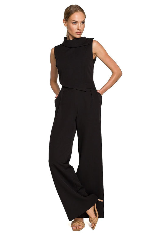 Nocturne Éclaire Jumpsuit – Vespera Edition: zwarte jumpsuit met wijde broekspijpen en decoratieve schoudersluiting voor avondgelegenheden.